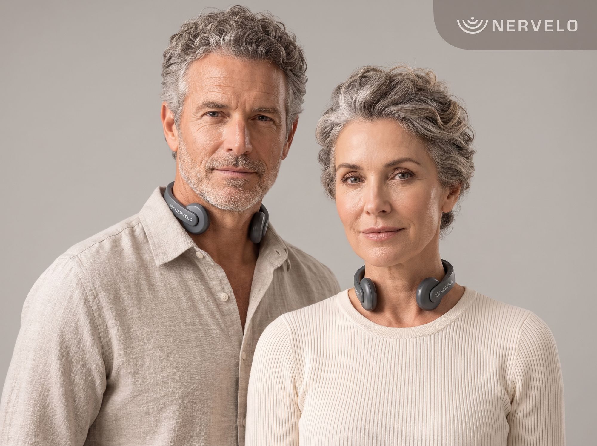 A man and a woman wearing the Nervelo wellness device around the neck